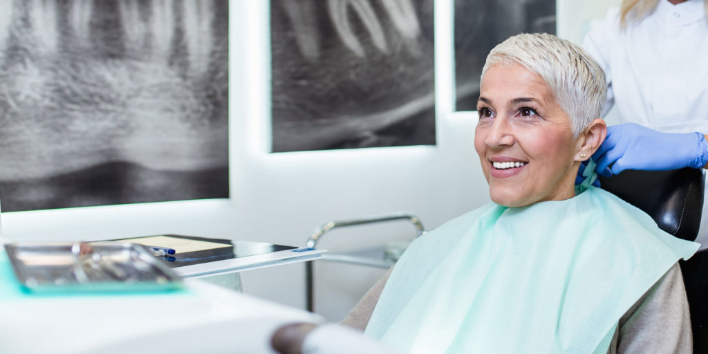dental patient discussing implant options with dentist